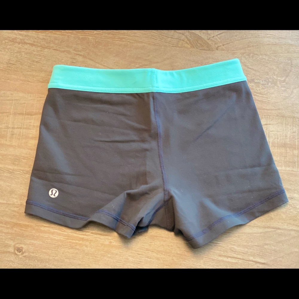 Lululemon shorts in size 2. Gray color with turquoise blue waist band.